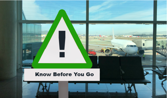 Sign saying know before you go overlooking airport