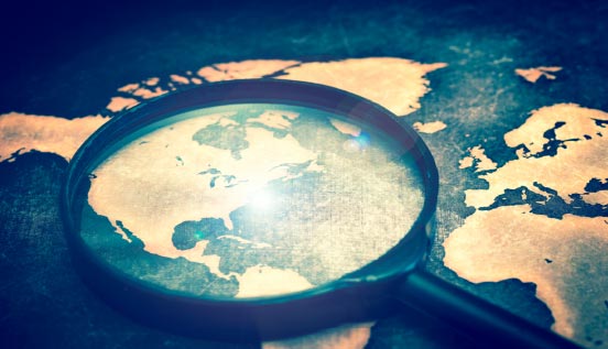 Magnifying glass on map Magnifying glass on map