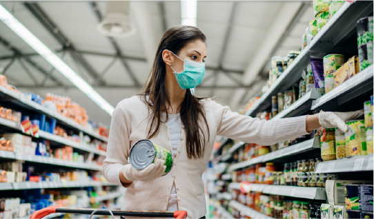 woman shopping in grocery store wearing facemask