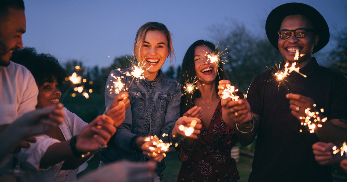 Business colleagues with sparklers on New Year's Eve