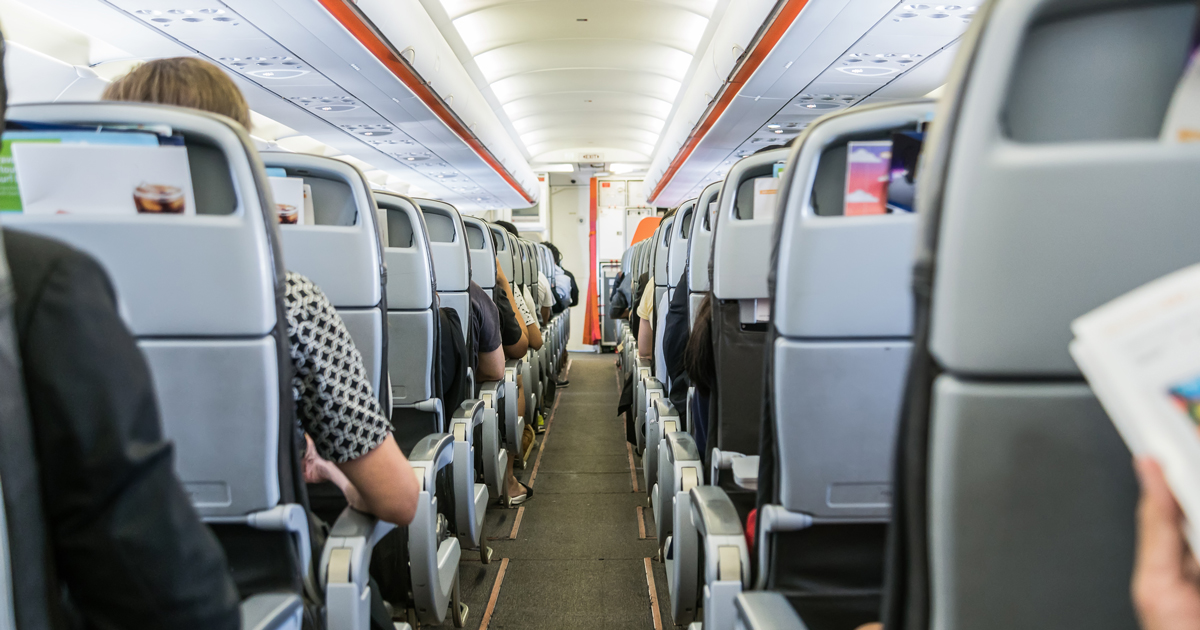 Business traveler view inside a full airplane